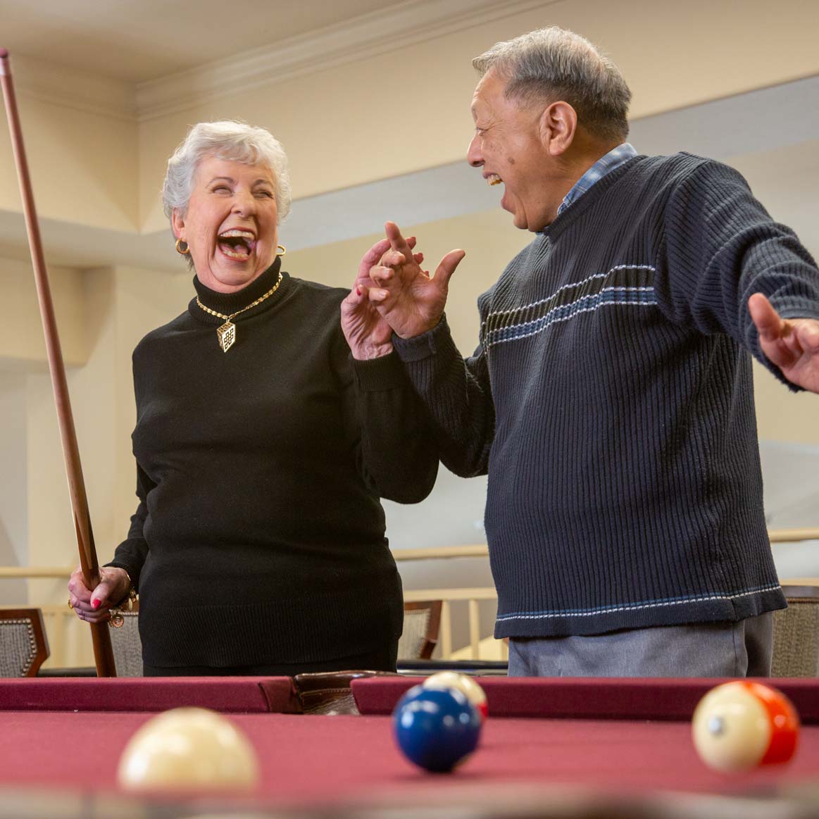 Residents playing billiards at Cypress Springs